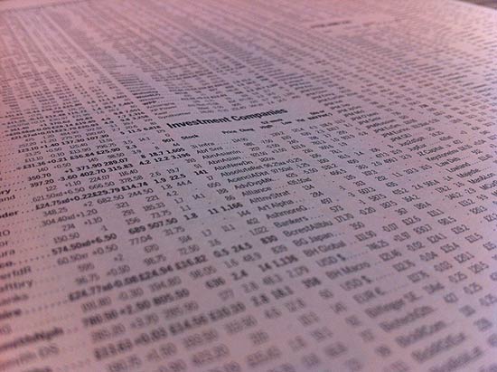Stock market quotes in a newspaper mimic spreadsheets?